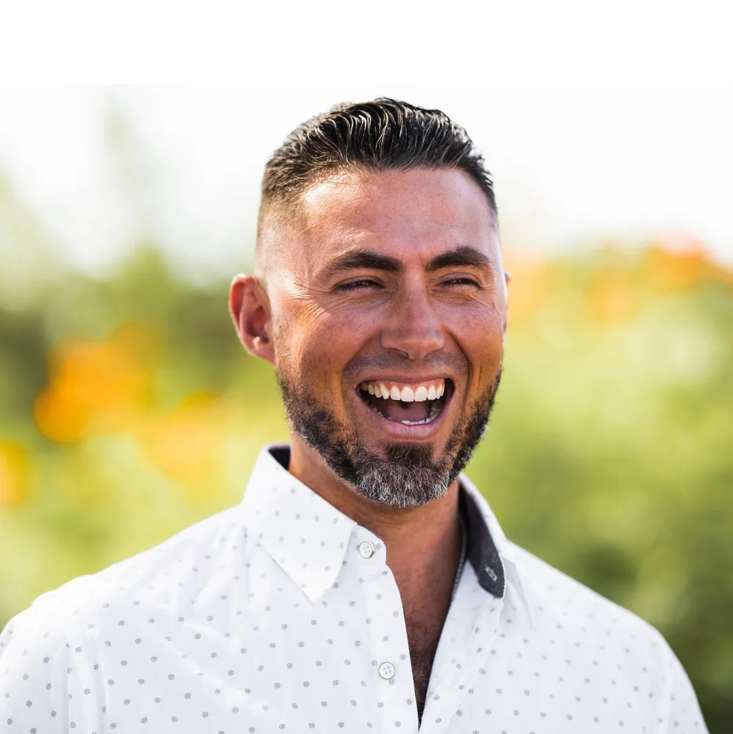 Brian Ballah, founder of Died to Live, laughing outdoors